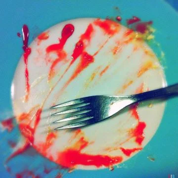 Dirty plate and fork Stock Photos