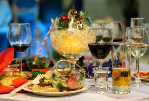 Dirty plates and half empty glasses on a Christmas party Stock Photos