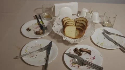 Dirty plates with leftovers on the restaurant table Stock Footage 315093144