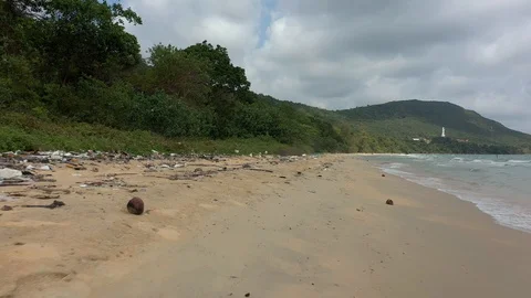 Dirty pollutedd beach lots of plastic everywhere onn a shore climate change glob Stock Footage 124603177