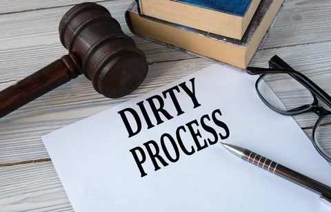 DIRTY PROCESS - words on white paper with the background of the judge's ham.. Stock Photos