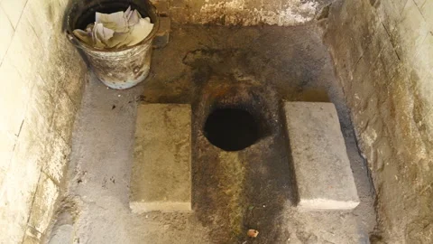 Dirty public outhouse with squat toilet ... | Stock Video | Pond5