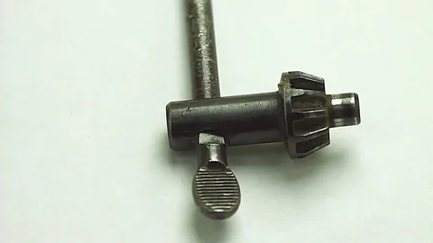 Dirty rusty tool rotates on plate Stock Footage 73715129