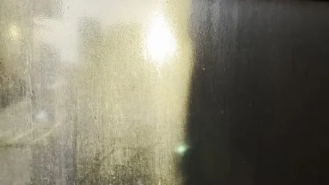 Dirty, scratched window overlooking the sunny city. Stock Footage 230968671