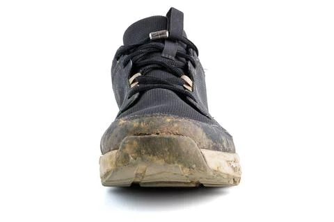 Dirty sneaker isolated on white background Photos