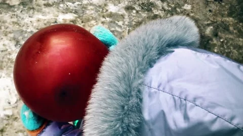 Dirty snow in the yard, kid with a ball Stock Footage 148128261