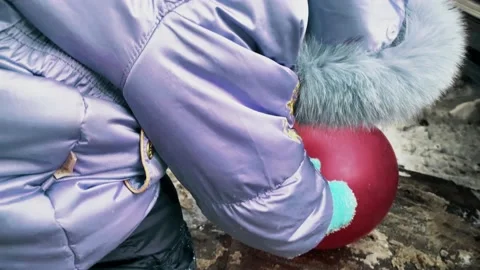 Dirty snow in the yard, kid with a ball Stock Footage 148128432
