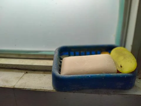 Dirty soap in the window side. 库存照片