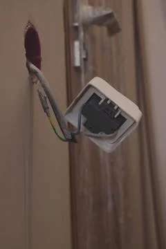 Dirty socket sticking out of the wall Stock Photos