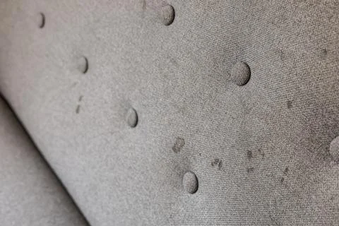 Dirty sofa, close up view. Stains on home textile. Upholstered furniture Stock Photos