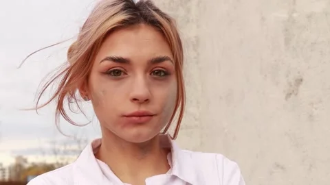 Dirty tired exhausted nurse outside hospital after hard working day or surgery Stock Footage 204866053