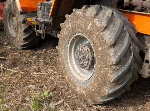 Dirty tractor wheels close up Stock Photos