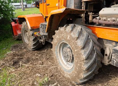 Dirty tractor wheels close up Stock Photos