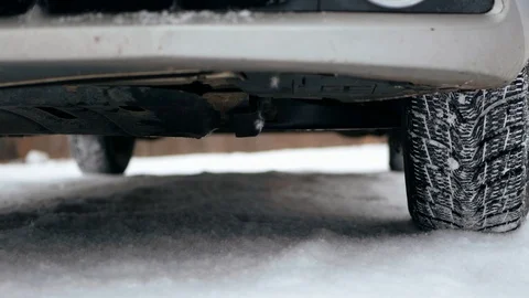 Dirty unwashed car. Tire wheel tread in the winter snowfall snowy weather Stock-Footage 107432453