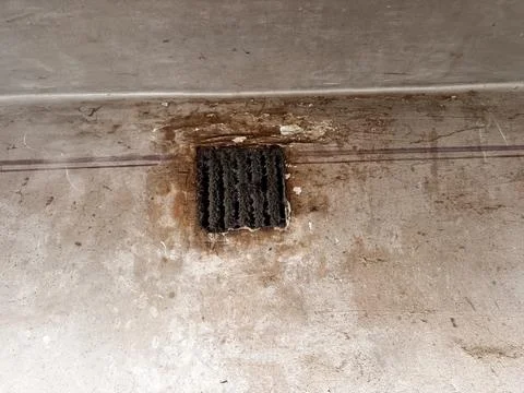 Dirty ventilation grate covered in thick dust and grime on a textured wall,.. 库存照片