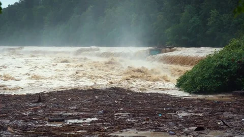 Dirty water flows in cascades after catastrophic floods Stock Footage 247441979