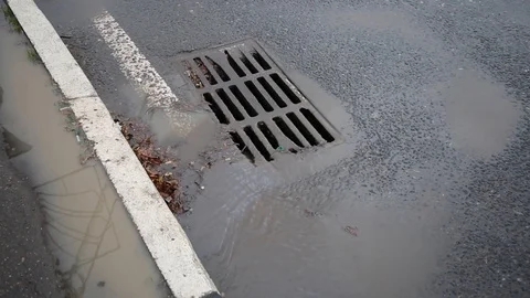 Dirty water flows down the drain Stock Footage 119983415