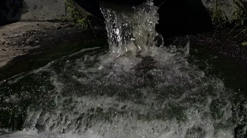 Dirty water flows from a pipe Stock Footage 77198531