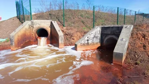 Dirty water flows from pipe sewer and sewerage toxic waste ecology concept Stock Footage 183550007