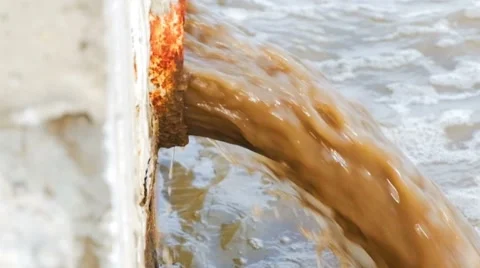 Dirty water flows from a pipe side view. The drain carries sewage Stock Footage 63227194