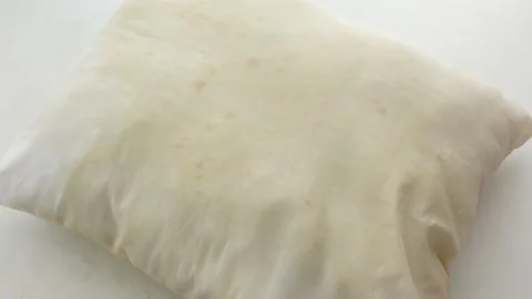 Dirty white pillow on table 動画素材 307667507