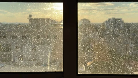 Dirty window is illuminated by the sun's rays Stock Footage 340016999