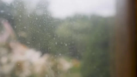 Dirty a window with out of focus background on a grey sky Stockbeeldmateriaal 317125001