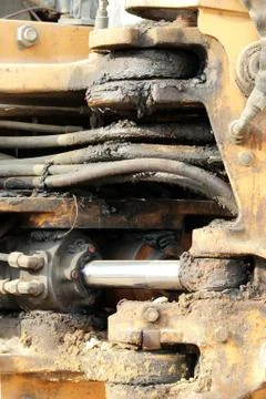 Dirty work hydraulic piston system and hoses for loader, chrome plated cylind Stock Photos