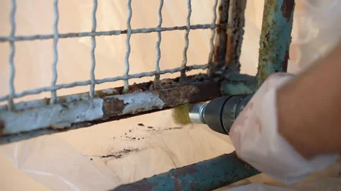 Dirty work process with corroded metal gate surface, workman in gloves using 스톡 동영상 226841396