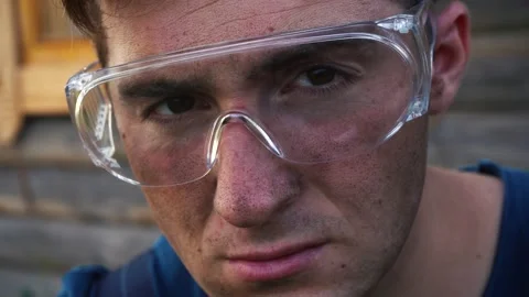Dirty worker at the construction site. looks at the camera with a serious face Stock Footage 164302392