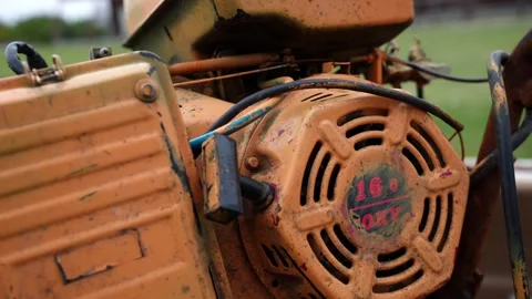 Dirty,old, weathered and rusty orange industrial engine or power generator Stock Footage 319791877