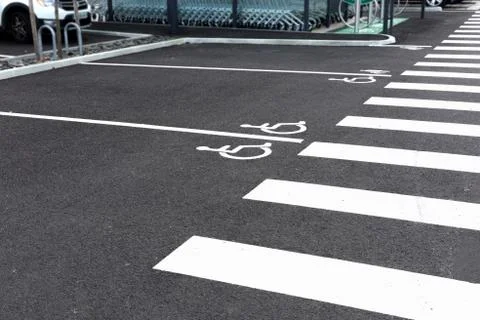 Disability empty parking spaces. Parking near the supermarket. Stock Photos