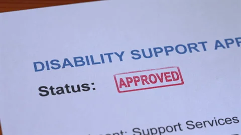 Disability Support Application Approved Stamp Coming Down on Form Stock Footage 342025042
