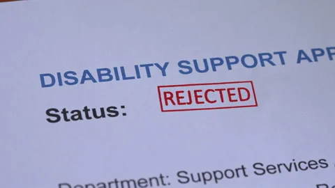 Disability Support Application Rejected Stamp Coming Down on Form Stock Footage 342034045