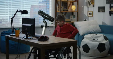A disable boy chatting on computer Stock Footage 107433697