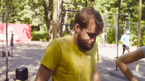 Disable man holding the parallel bars standing on his legs Video stock 93812394