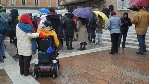  A disable old man during a rally against migrant deaths at sea Stock Footage 102269270