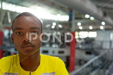 Disabled African American male athletic looking at camera in fitness center Stock Photos