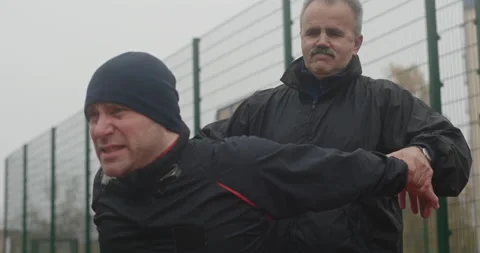 Disabled athlete exercising with trainer Stock Footage 160100283