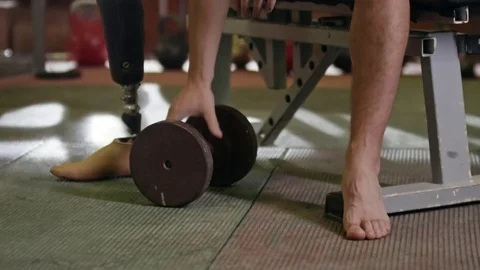 Disabled Athlete Working Out Hard with Dumbbell Stock Footage 72139852