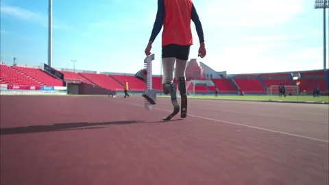 Disabled athletes prepare block start in starting position ready to run Stock Footage 257666065