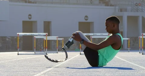 Disabled athletic exercising on a running track 4k Stock Footage 96094529