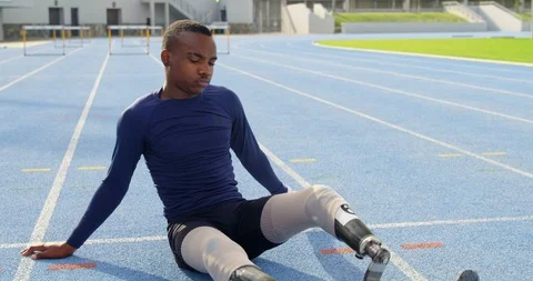 Disabled athletic exercising on a running track 4k Stock Footage 96094599