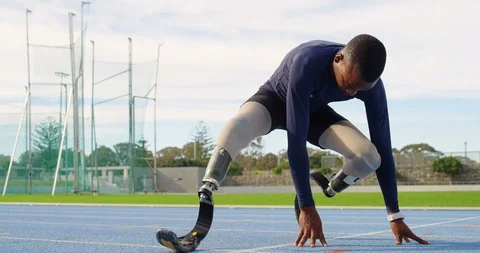 Disabled athletic exercising on a running track 4k Stock Footage 96094603