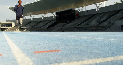 Disabled athletic running on a running track 4k Stock Footage 96094559