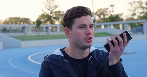 Disabled athletic talking on mobile phone 4k Stock Footage 96094424