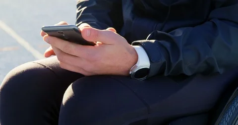 Disabled athletic using mobile phone at sports venue 4k 스톡 동영상 96094496