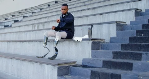 Disabled athletic using smartwatch 4k Stock Footage 96094478