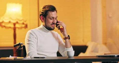 A disabled bearded middle aged man in a wheelchair sits in loft house and Stock Footage 146023599