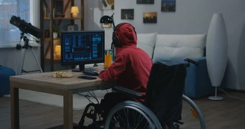 Disabled boy hacking on his computer Stock Footage 107435053